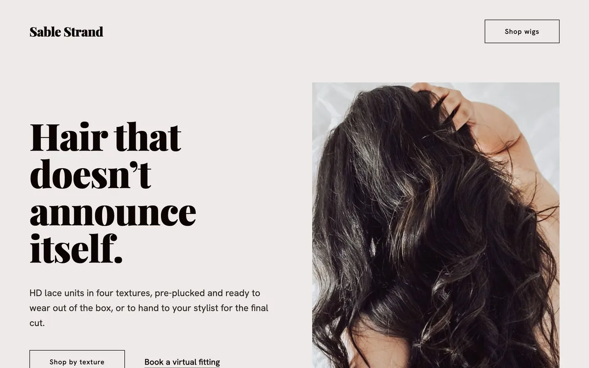 Sable Strand hero: serif headline Hair that doesn’t announce itself beside a photo of long dark body-wave hair