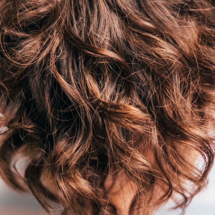 Close-up of brown deep-wave hair